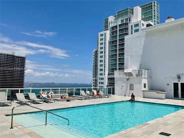 pool with a city view and a patio area