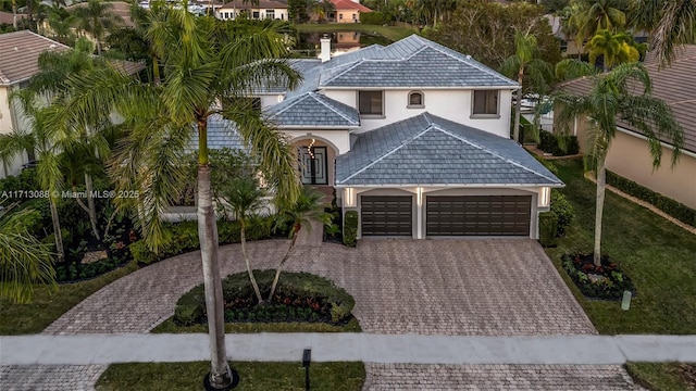 view of front of property with a garage