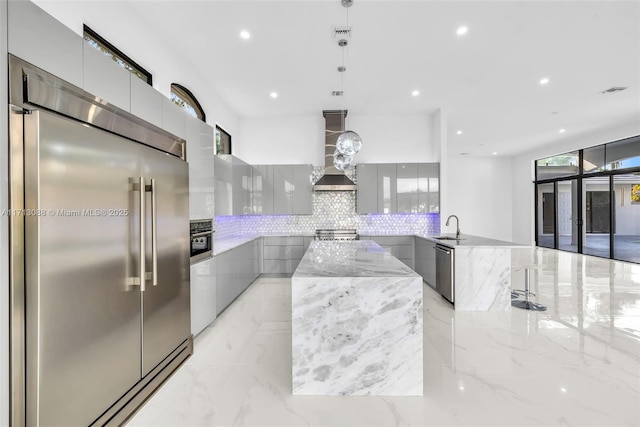 kitchen with modern cabinets and appliances with stainless steel finishes