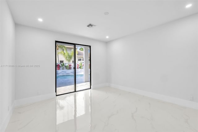 spare room featuring marble finish floor, visible vents, and recessed lighting