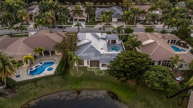 birds eye view of property with a residential view