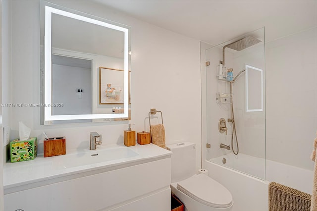 bathroom featuring shower / bathtub combination, toilet, and vanity