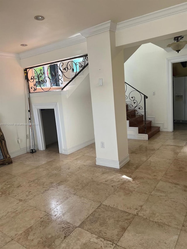 unfurnished living room featuring ornamental molding