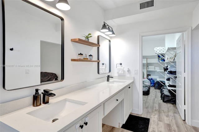 bathroom featuring vanity and hardwood / wood-style flooring