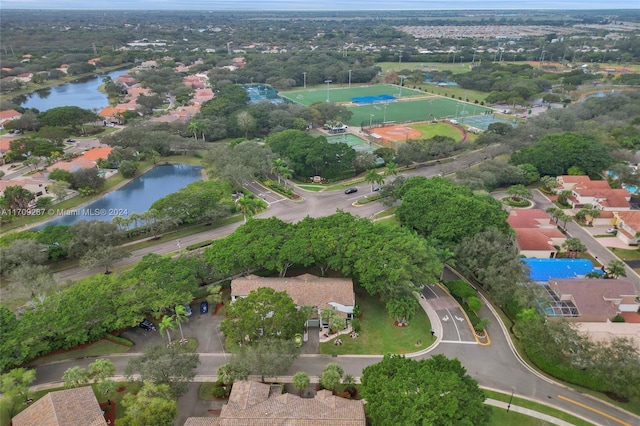 birds eye view of property with a water view