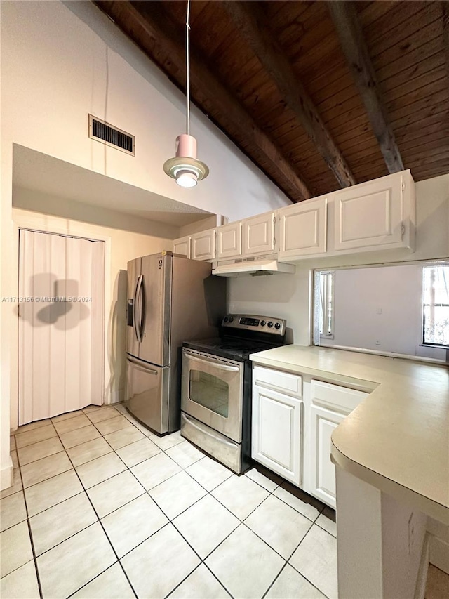 kitchen with pendant lighting, light tile patterned floors, beamed ceiling, white cabinetry, and stainless steel appliances