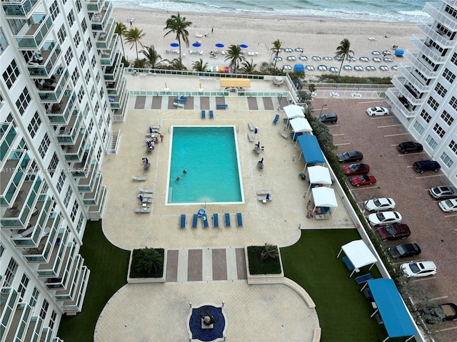 bird's eye view with a beach view and a water view