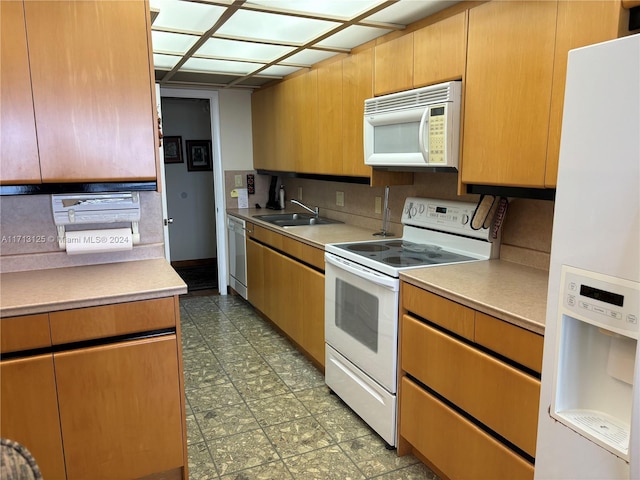 kitchen with sink and white appliances