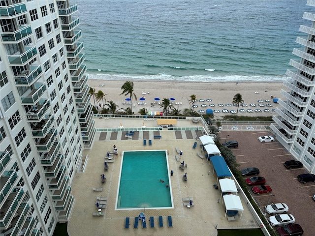 aerial view featuring a water view and a view of the beach