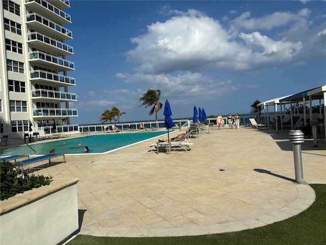 view of swimming pool with a patio area