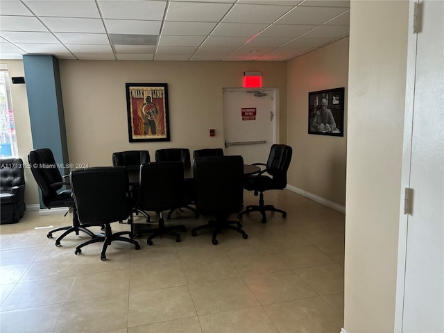 office featuring light tile patterned floors and a paneled ceiling