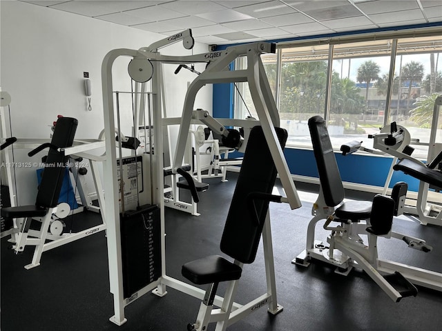 workout area with a paneled ceiling