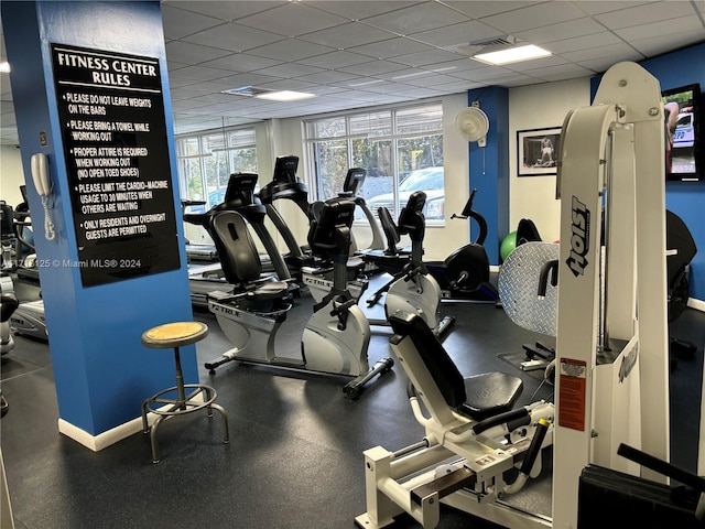 gym featuring a paneled ceiling