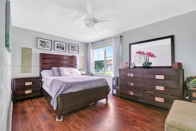 bedroom featuring hardwood / wood-style floors and a ceiling fan