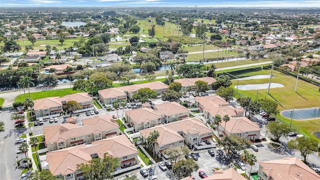 birds eye view of property featuring a residential view and a water view