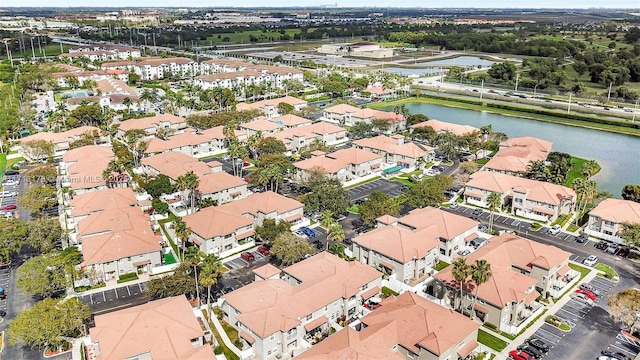 birds eye view of property with a residential view and a water view