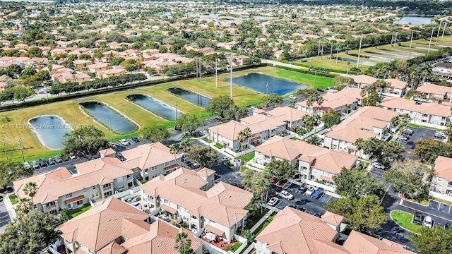 aerial view with a residential view and a water view