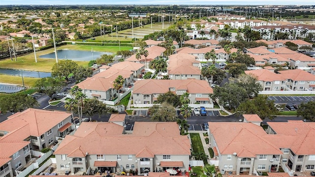 aerial view with a residential view and a water view