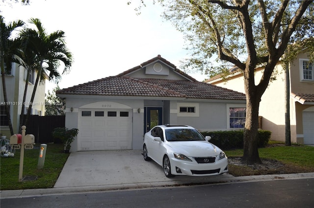 view of front facade with a front lawn and a garage