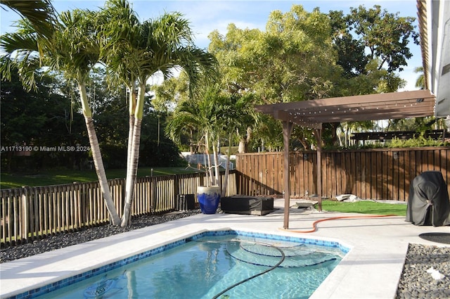 view of pool featuring a pergola and a patio