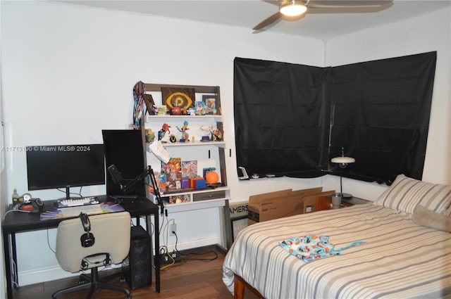 bedroom with ceiling fan and hardwood / wood-style floors