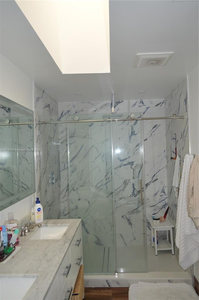 bathroom featuring vanity and walk in shower