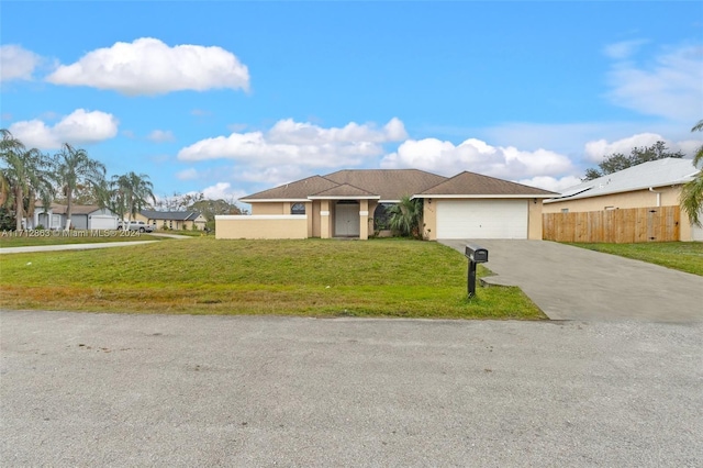 view of front of property featuring a front lawn and a garage