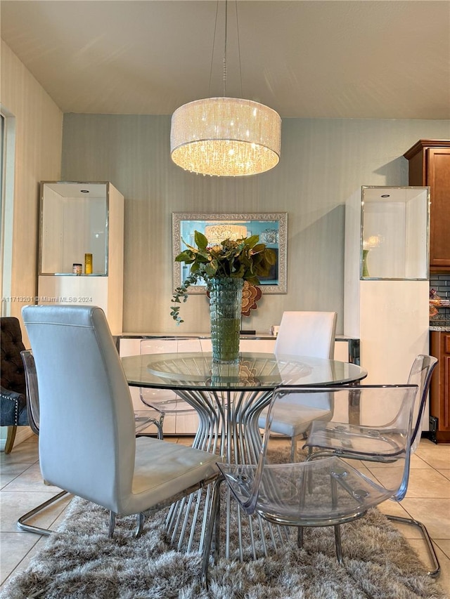 tiled dining area featuring an inviting chandelier