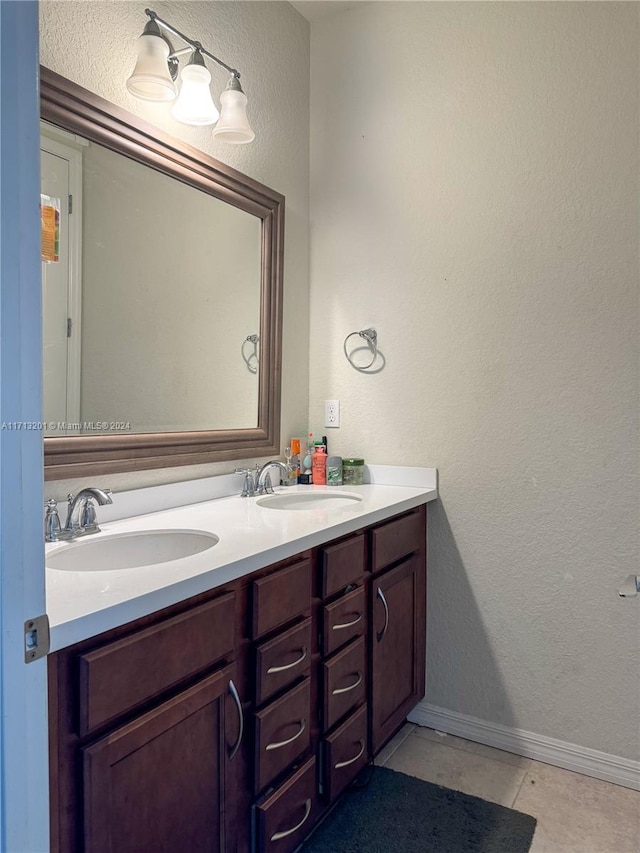 bathroom with tile patterned floors and vanity