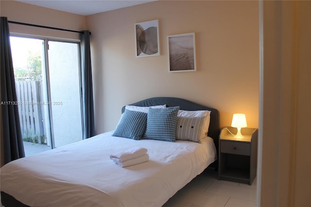 bedroom featuring light tile patterned flooring