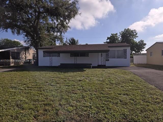 view of front of home with a front yard