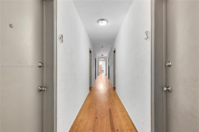 hallway featuring hardwood / wood-style flooring