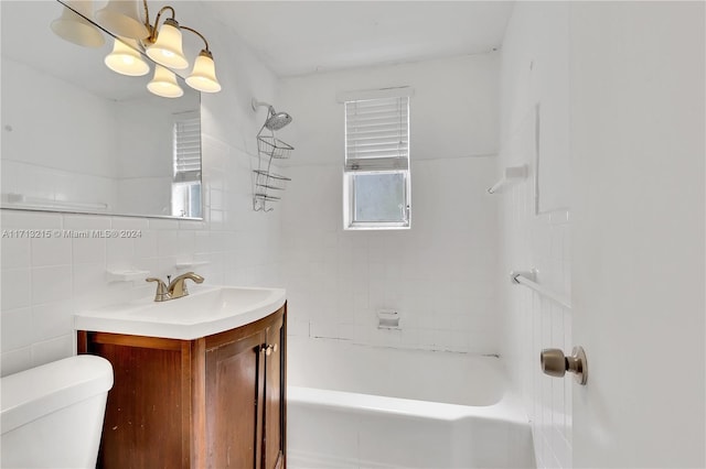 full bathroom featuring tasteful backsplash, a notable chandelier, toilet, vanity, and tile walls