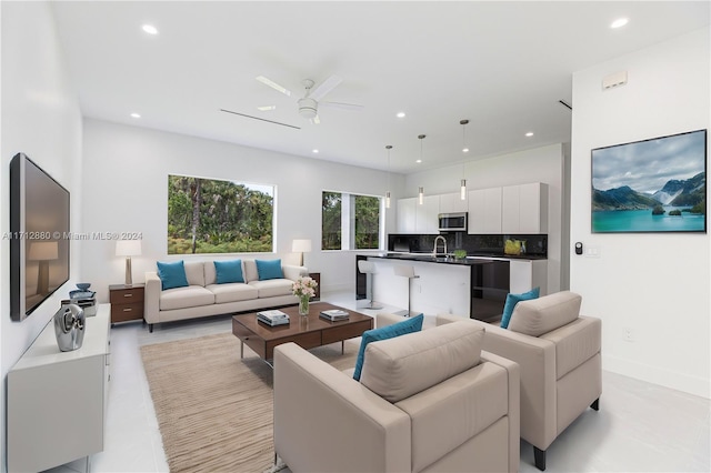 living room featuring sink and ceiling fan