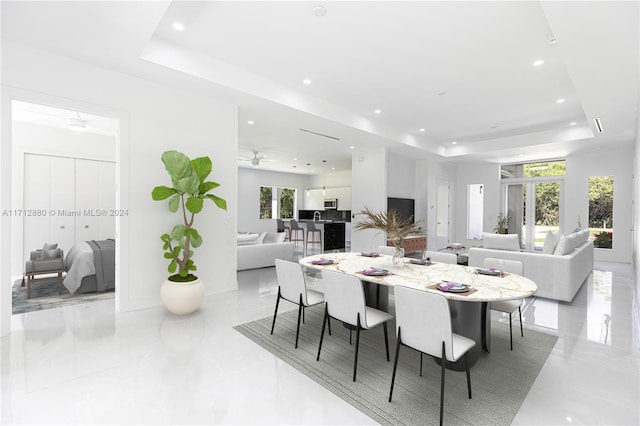 dining area featuring a tray ceiling