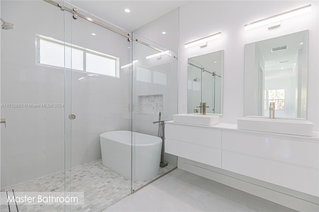 bathroom featuring vanity, tile patterned flooring, and independent shower and bath