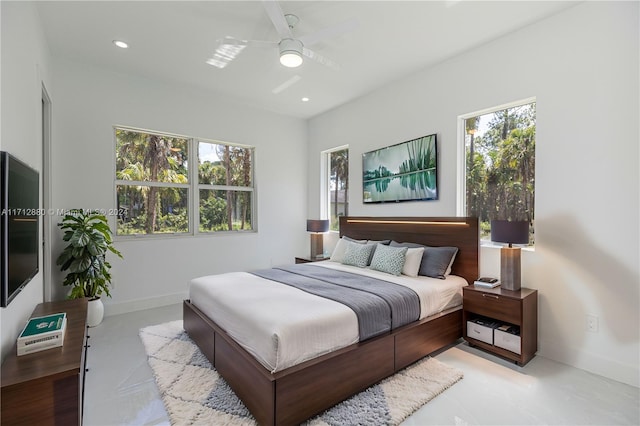 bedroom with multiple windows and ceiling fan