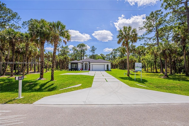 single story home with a garage and a front yard