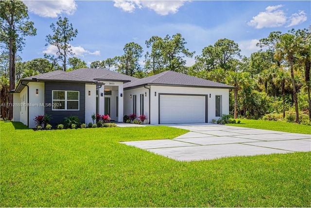 view of front of property featuring a garage and a front lawn