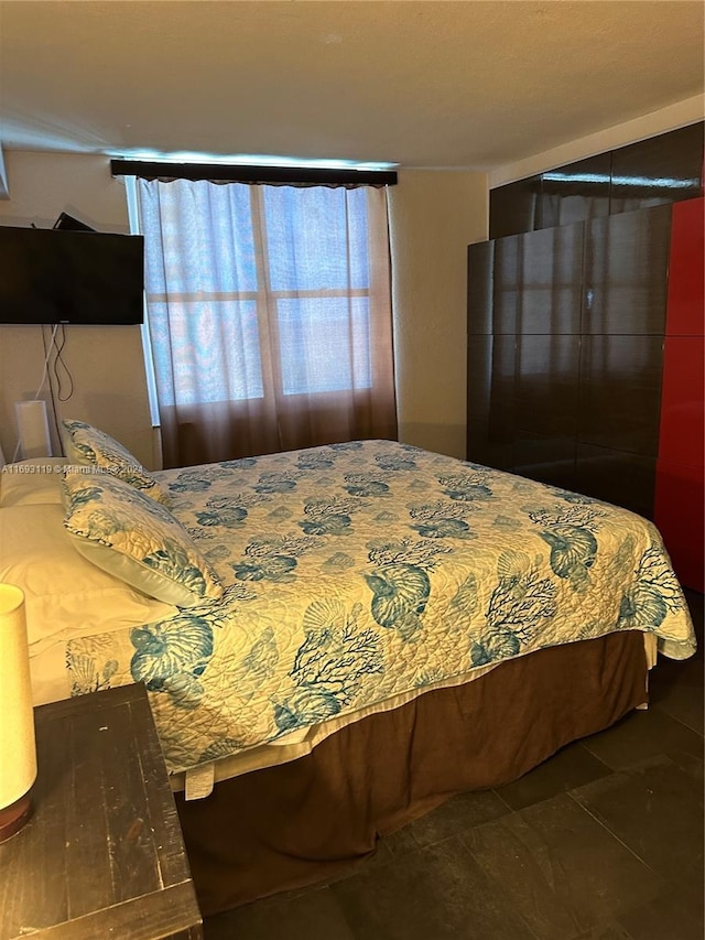 bedroom featuring tile patterned flooring