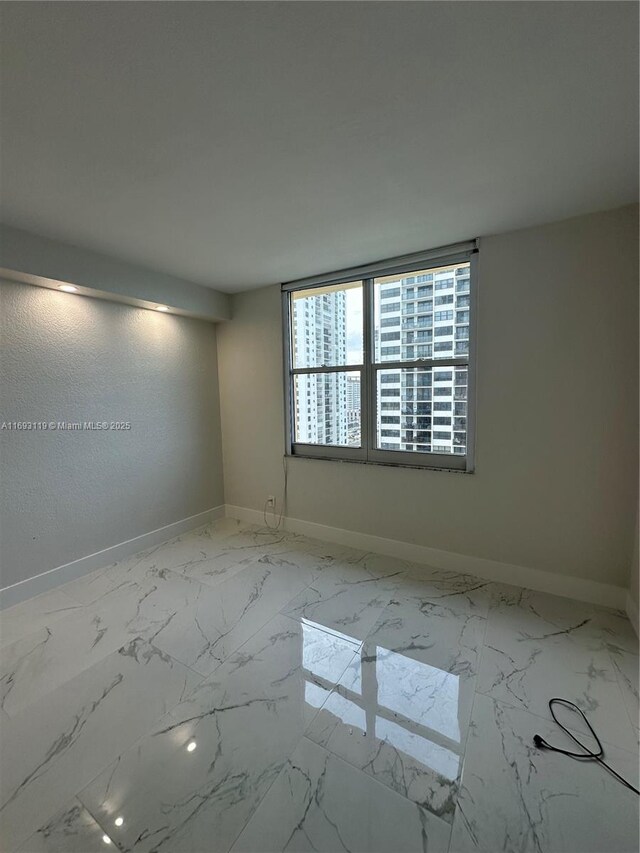 2501 S Ocean Dr Unit 1208, Hollywood, FL 33019 - unfurnished room featuring baseboards and marble finish floors