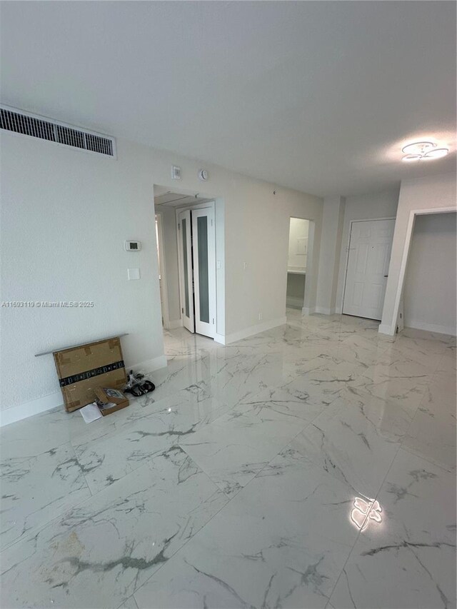 2501 S Ocean Dr Unit 1208, Hollywood, FL 33019 - spare room featuring baseboards and marble finish floors
