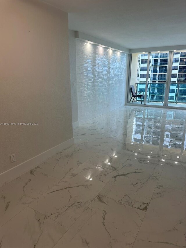 2501 S Ocean Dr Unit 1208, Hollywood, FL 33019 - empty room with baseboards and marble finish floors