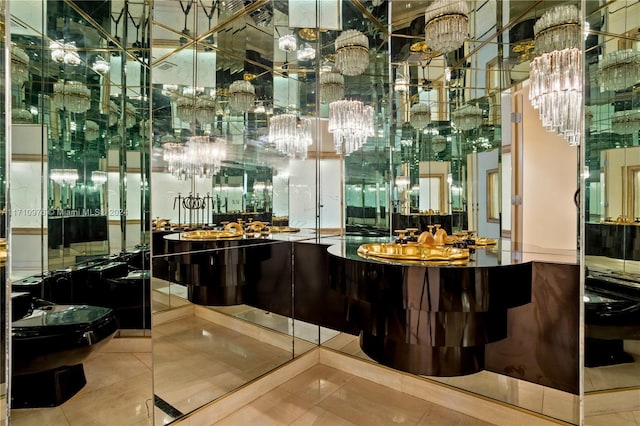 bar featuring tile patterned flooring and a chandelier