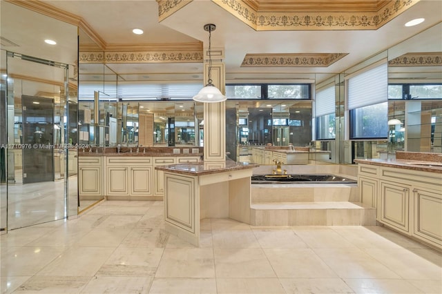 bathroom featuring vanity, crown molding, and a relaxing tiled tub