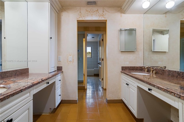 bathroom featuring tile patterned flooring and vanity