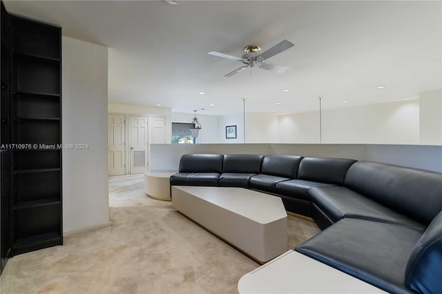 carpeted living room featuring ceiling fan