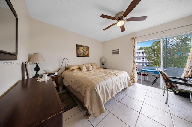 bedroom with ceiling fan, light tile patterned flooring, lofted ceiling, and a textured ceiling