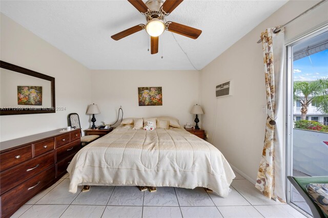 bedroom featuring access to exterior, ceiling fan, a wall unit AC, lofted ceiling, and light tile patterned flooring