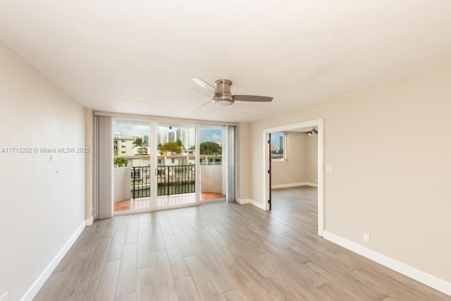 unfurnished room featuring light hardwood / wood-style flooring and ceiling fan